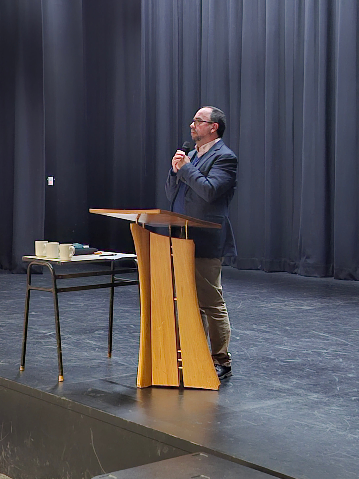 Dr Paul Morrissey speaking from the podium during the evening keynote