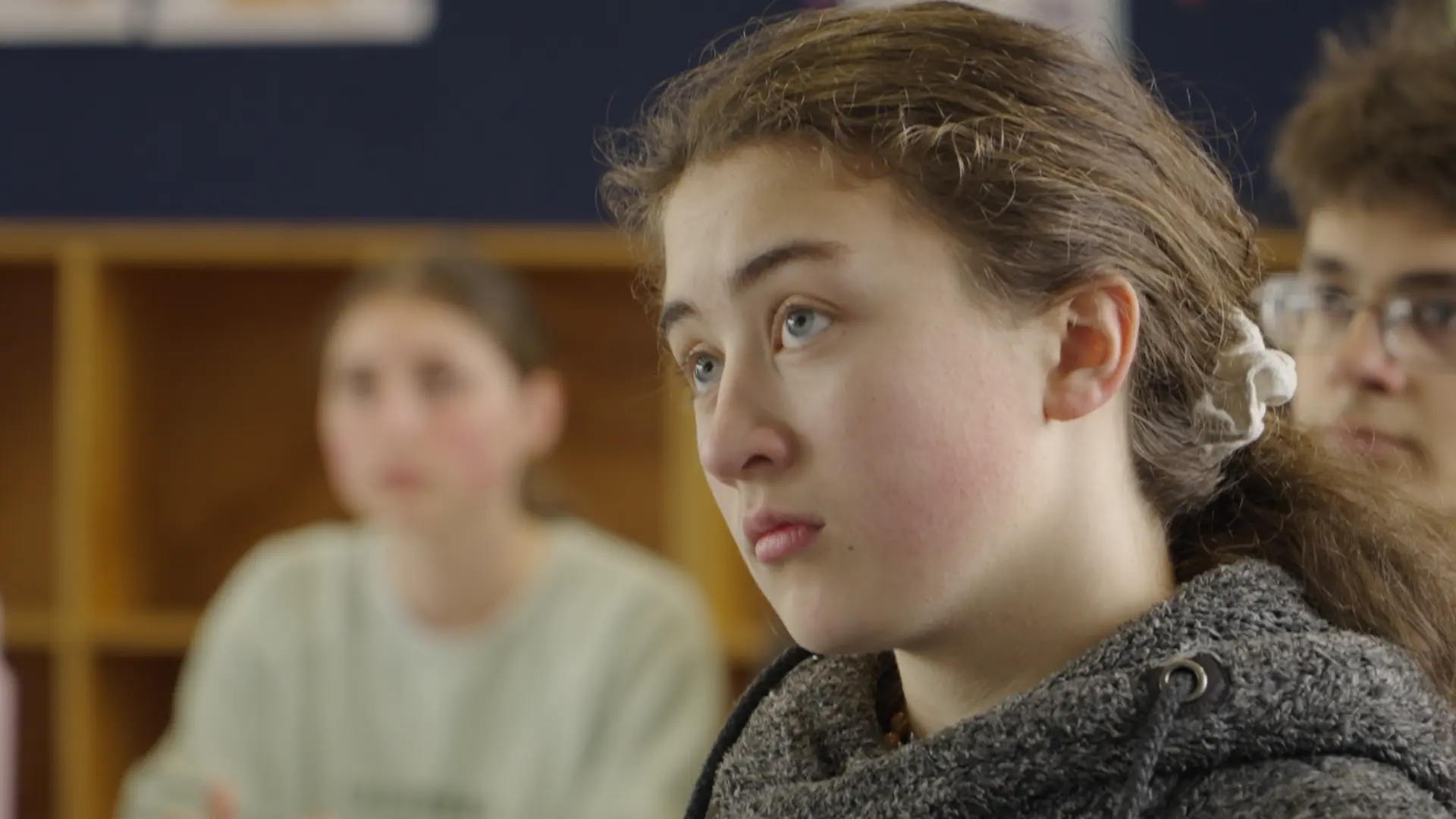 A student listening closely during a lesson at the 2024 Intensive