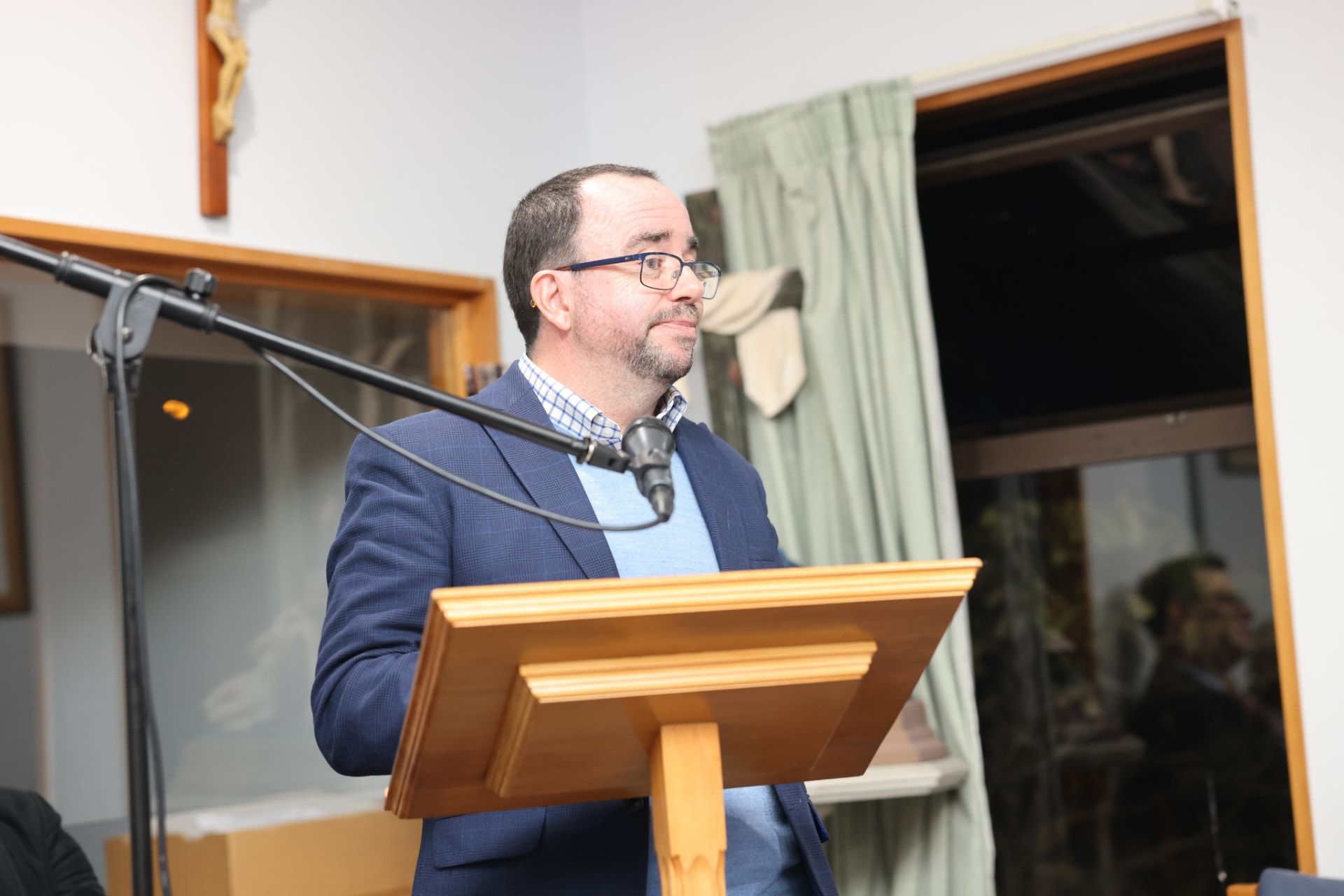 A speaker at the lectern during the inaugural evening