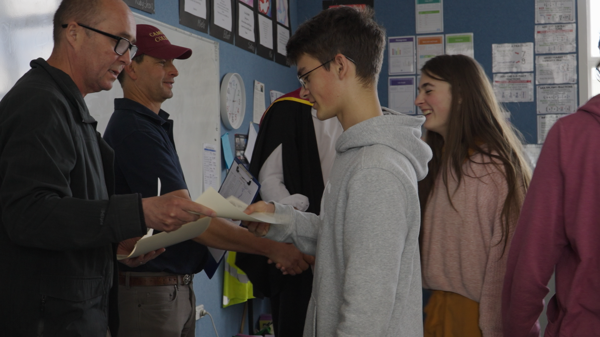 A student receiving his certificate at the 2024 Intensive