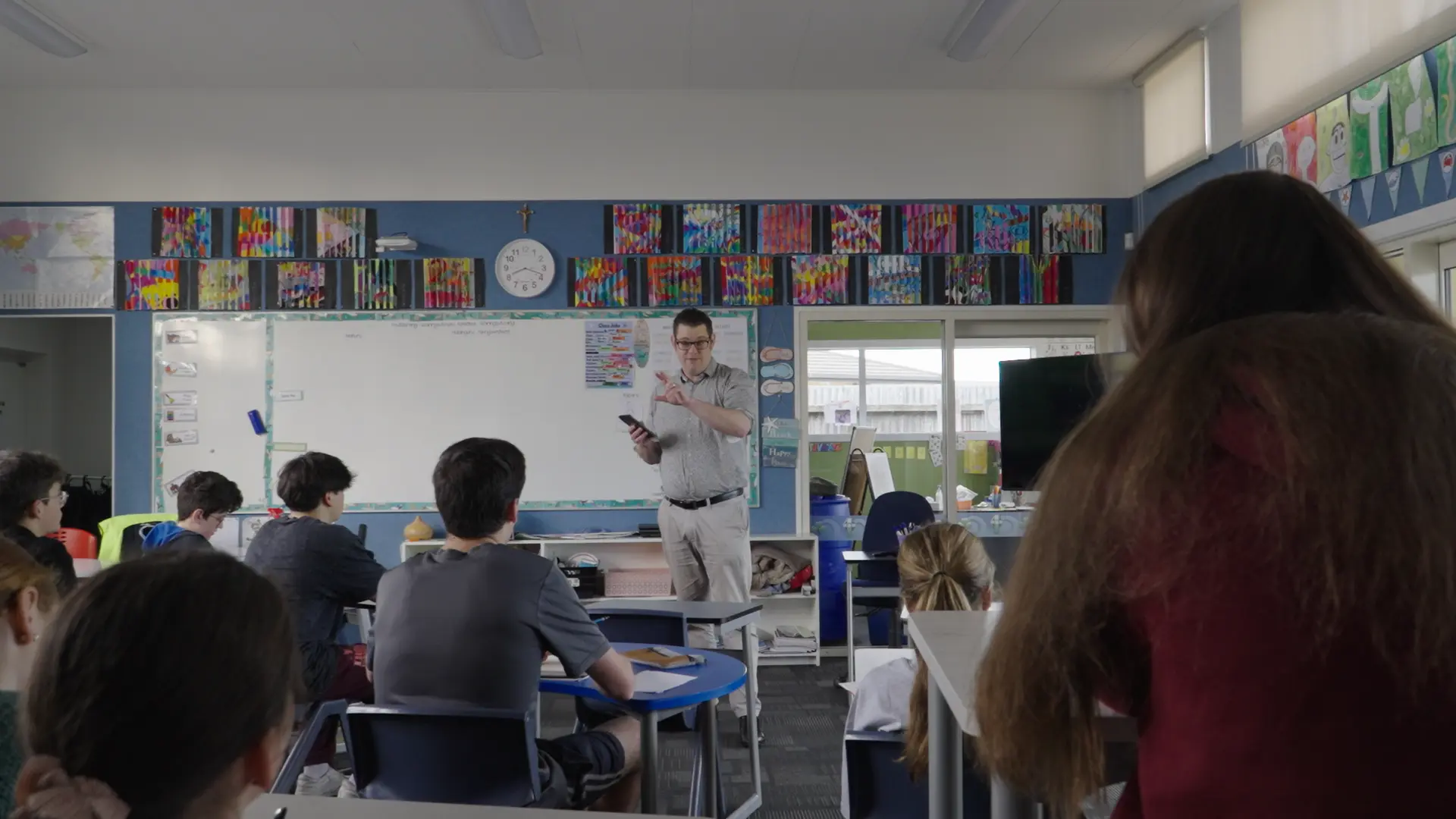 A tutor teaching from the whiteboard during the 2024 Intensive