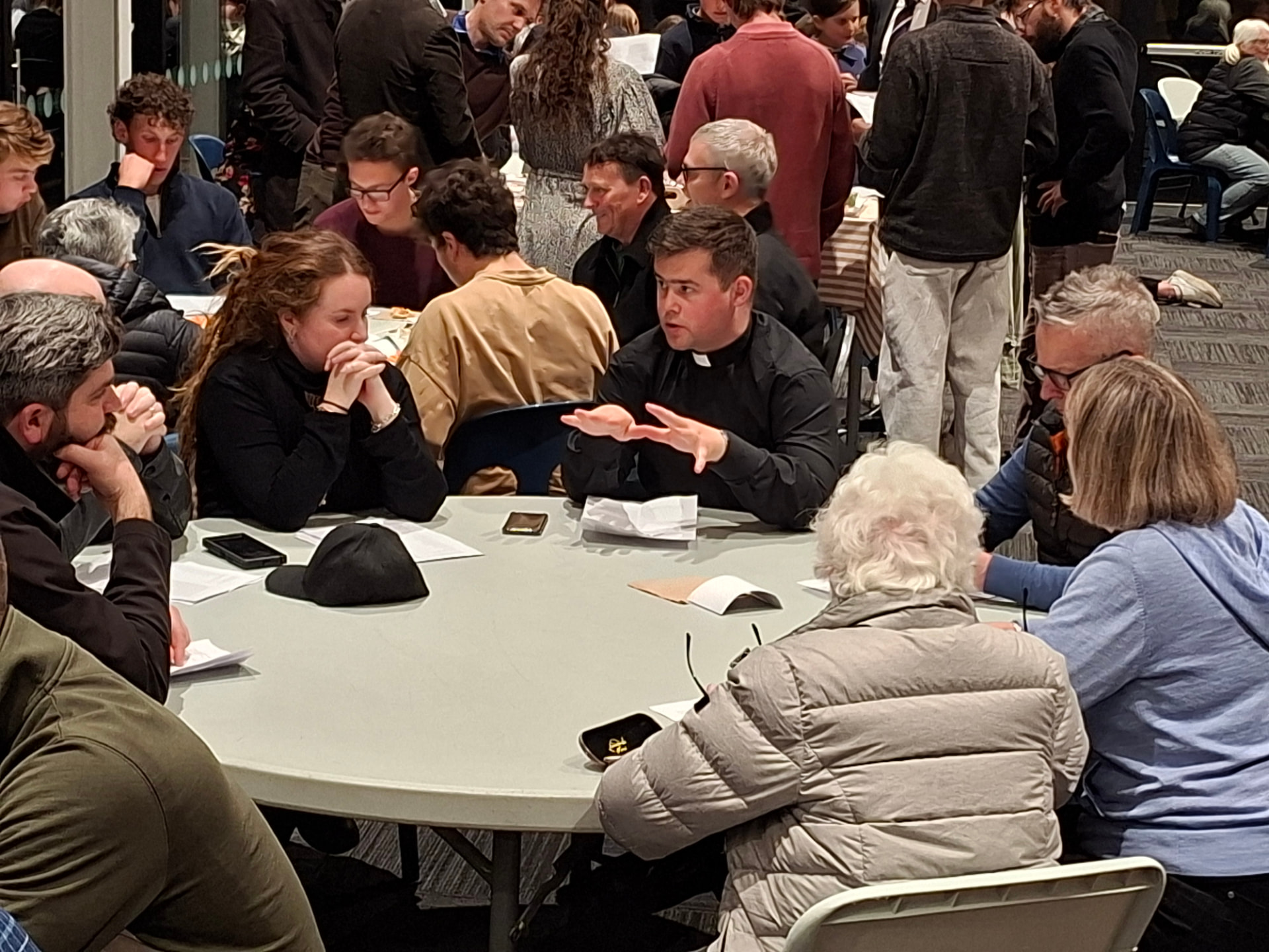 A facilitated table discussion during supper