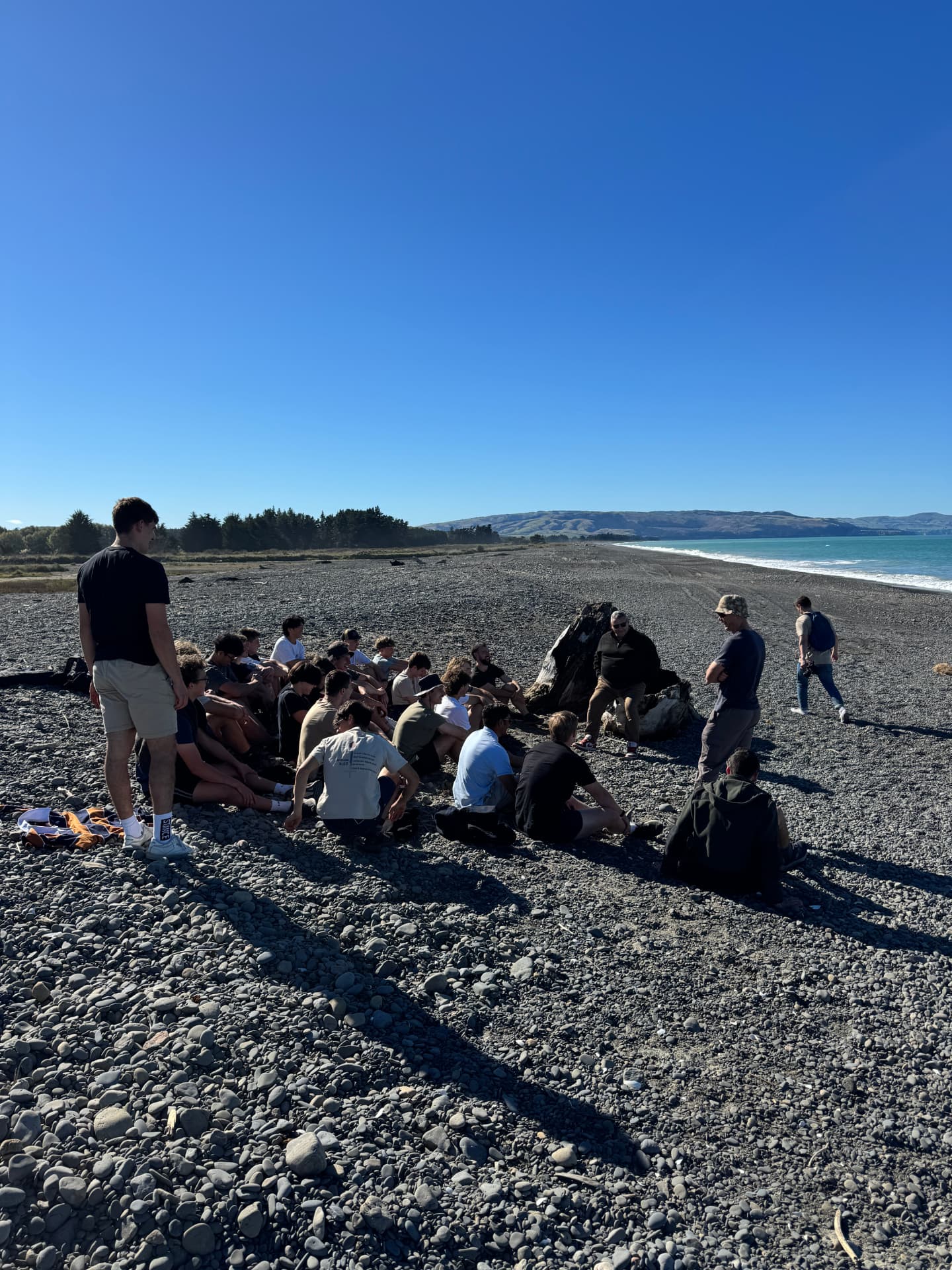 The group gathered on the beach during the Liberate trek