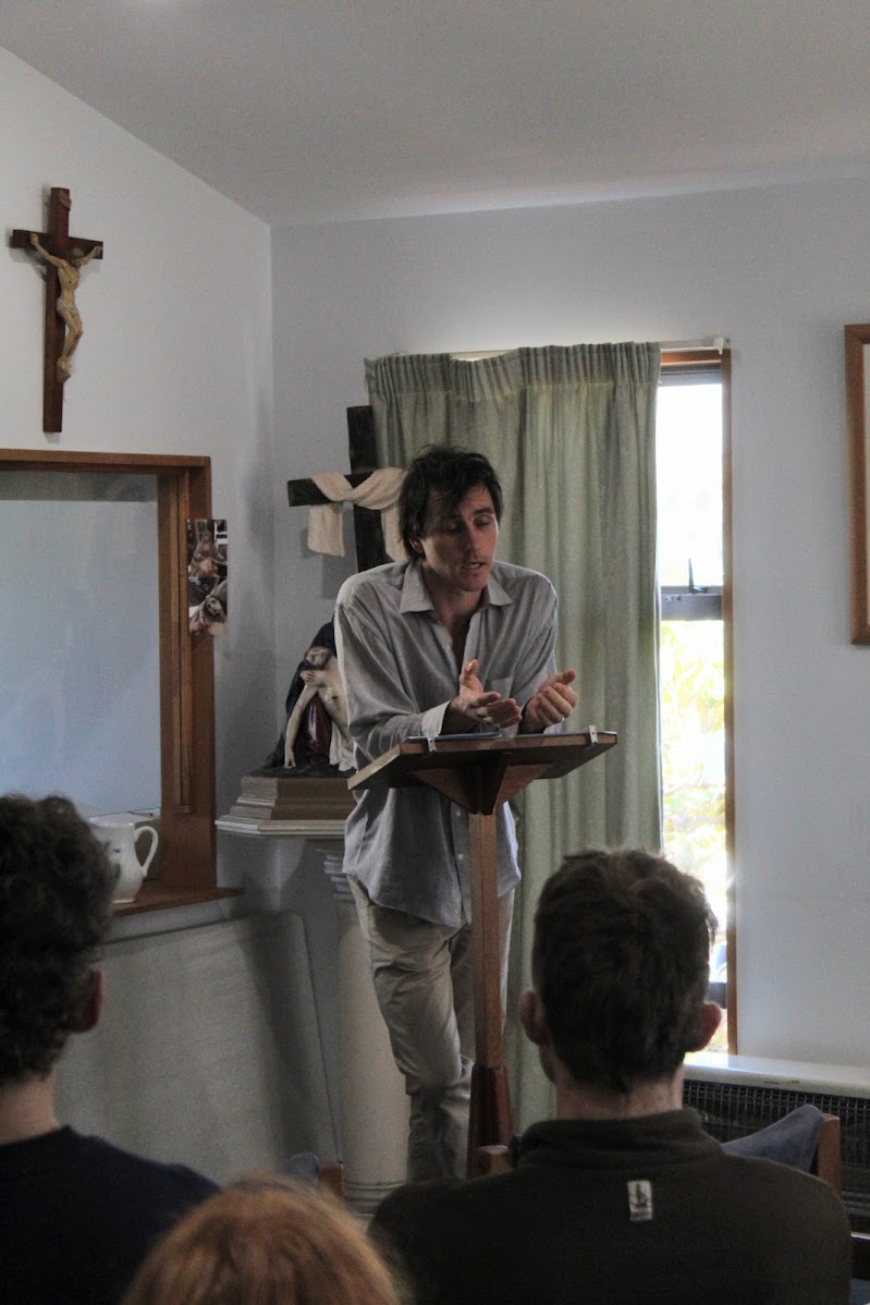 A speaker in discussion with the audience at the inaugural evening